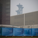 The Olympic Tower is seen behind a a barricade that delimitates the area not accessible to the general public, that will host Beijing 2022 Winter Olympics at Olympic Park on January 23, 2022 in Beijing, China.